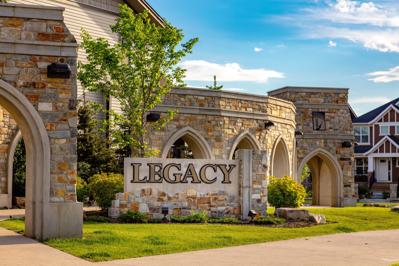 Legacy neighbourhood sign and stone entrance arches